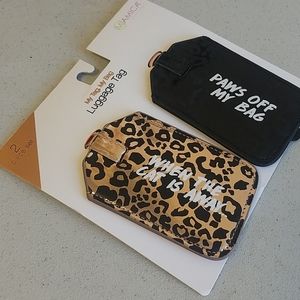 Luggage tags set when the cat is away..